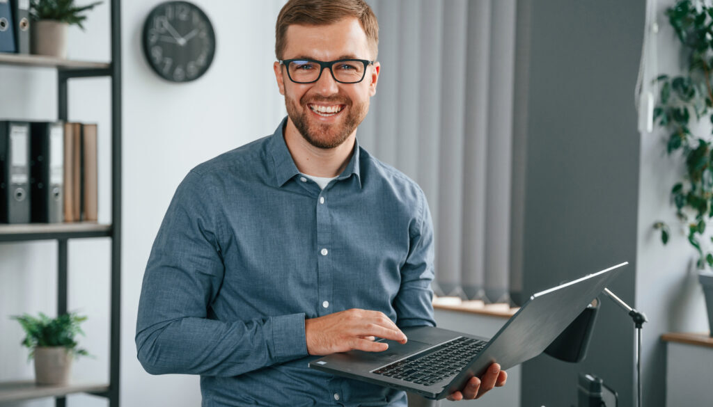 Man is working in the modern office. Conception of business and freelance