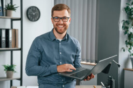 Man is working in the modern office. Conception of business and freelance