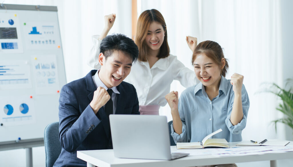 People evaluate positive results of work on charts in office of crypto currency. At ounseling cent