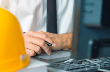 Architect working with sketch pen tablet and CAD software